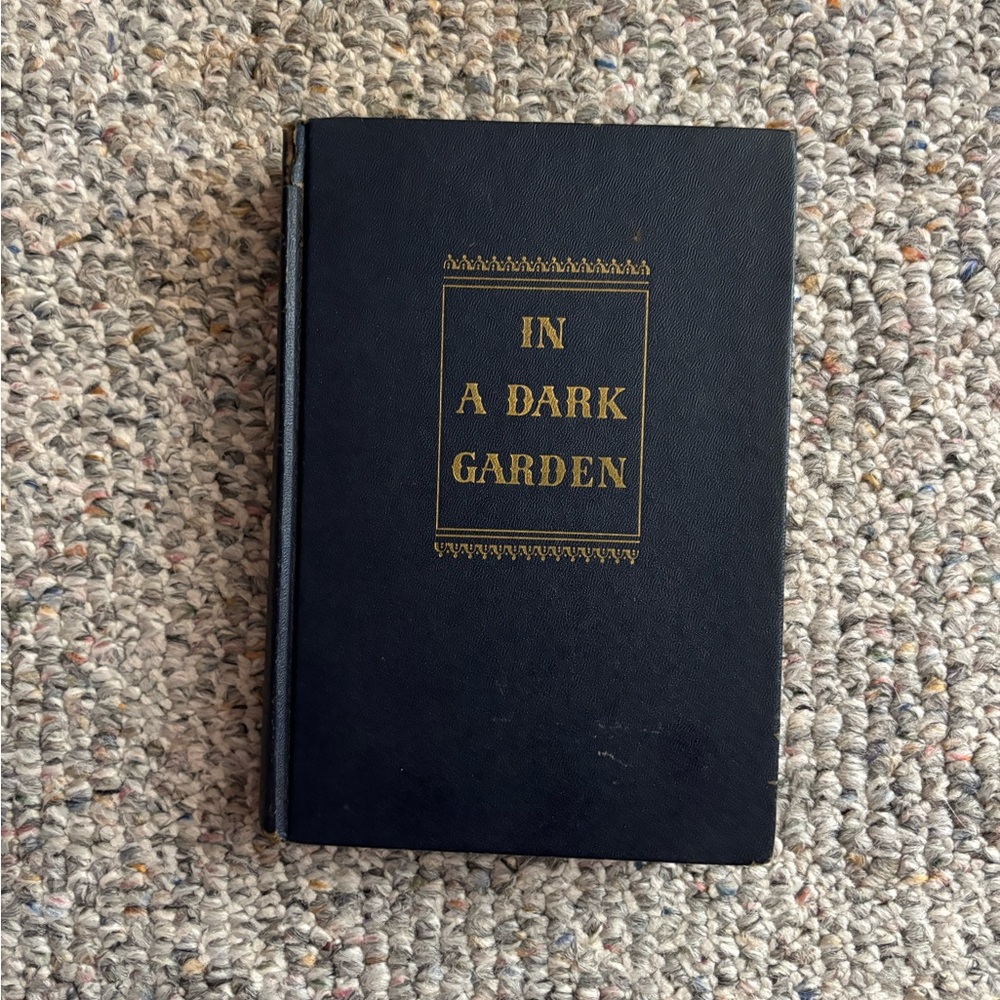 1946- In A Dark Garden Hardcover Book